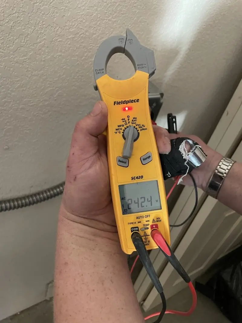 Voltage testing with clamp meter during Ceiling Fan Installation in North Franklin